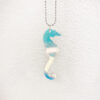 Seahorse pendant in iridescent acrylic.